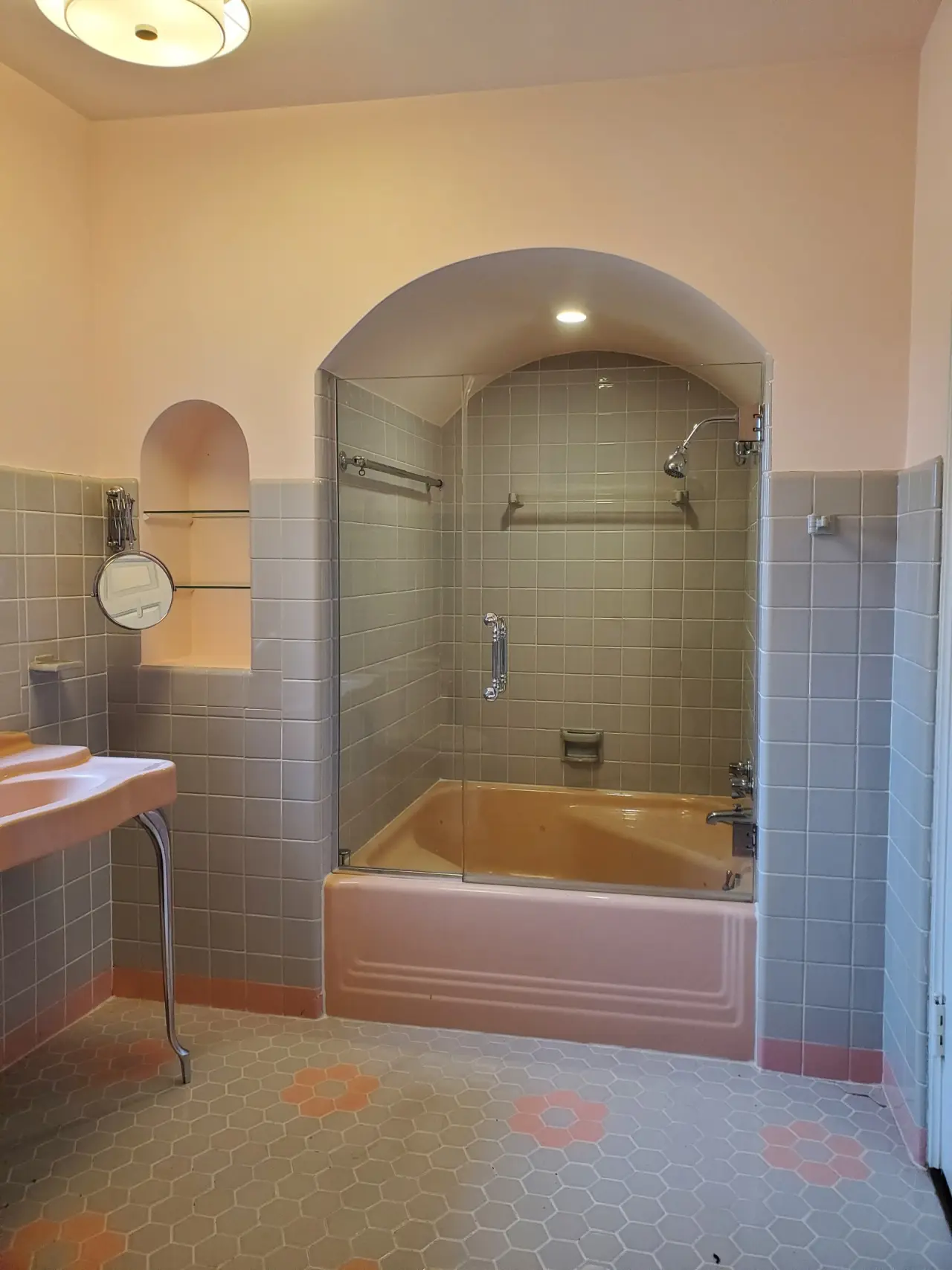 Before: Peach tub alcove to a walk-in tile shower