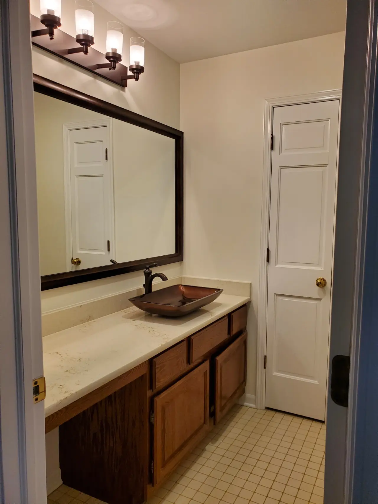 Before: Single oak vanity to a navy double vanity